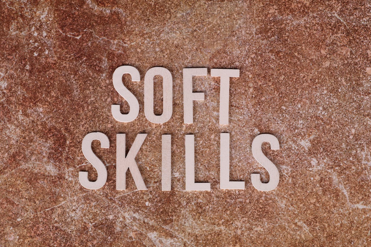 Crafting Captivating Headlines: Your awesome post title goes here Close-up of the words 'Soft Skills' on a textured stone background for presentations or articles.